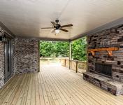 Outdoor Deck with Brick Fireplace in The Aragon built by Waterford Homes in Sandy Springs